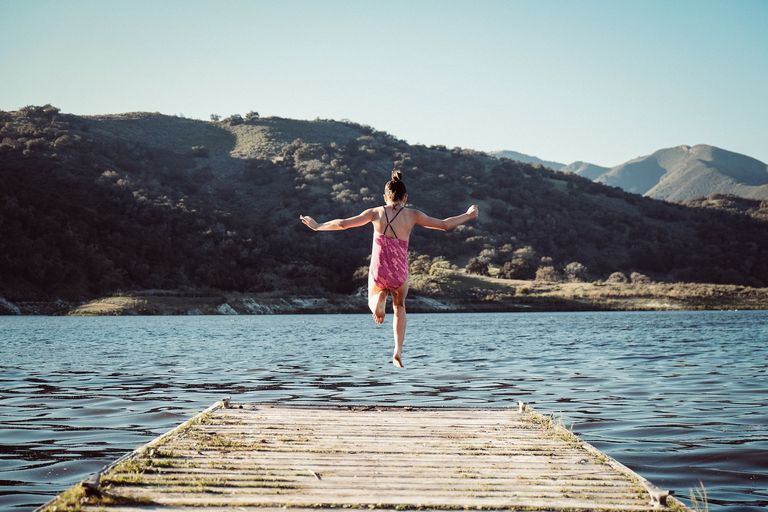 Person jumping off the end of a boardwalk